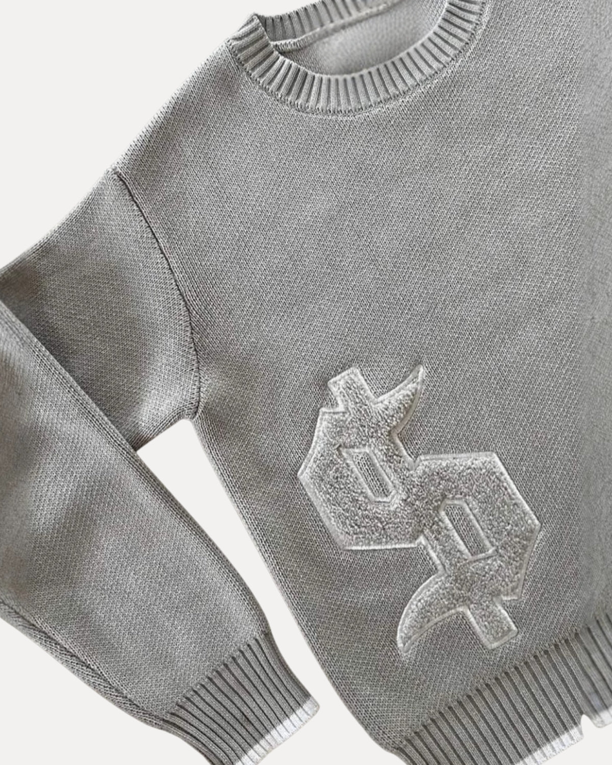 "DOLLAR" KNIT SWEATER